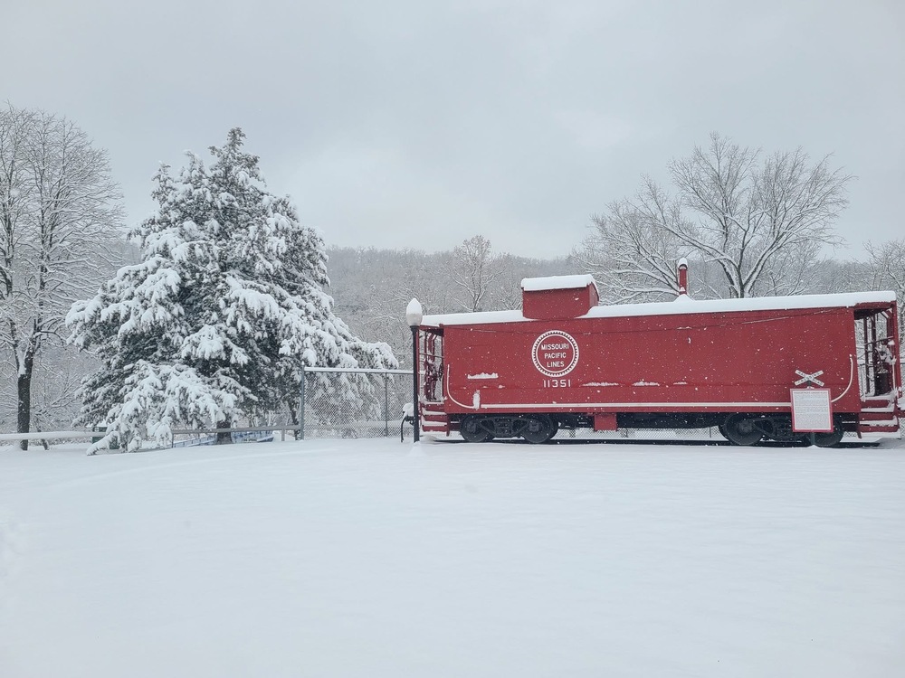 Railroad car covered in snow