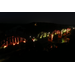 Cotter Bridge lit in orange and green lights